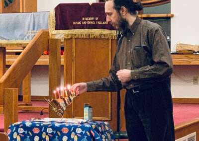 Rabbi Marmon Lighting Chanukah Candles at Congregation Shaara Tfille