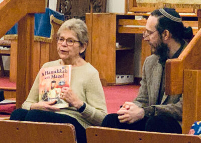 Rabbi Marmon and a congregant Reading Chanukah Stories for Chanukah 2021 at Congregation Shaara Tfille