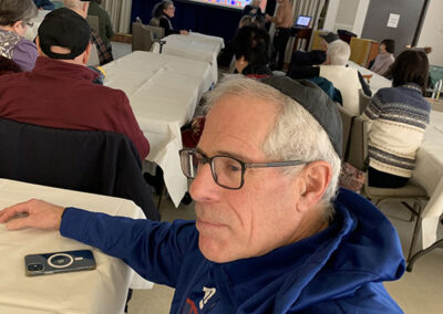 Congregant listening to presentation at Saratoga Jewish Community Center in Saratoga Springs, New York