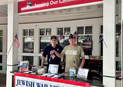 Commander Sam Gottesman, and fellow JWV member Ed Balaban at the Saratoga Race Course booth.